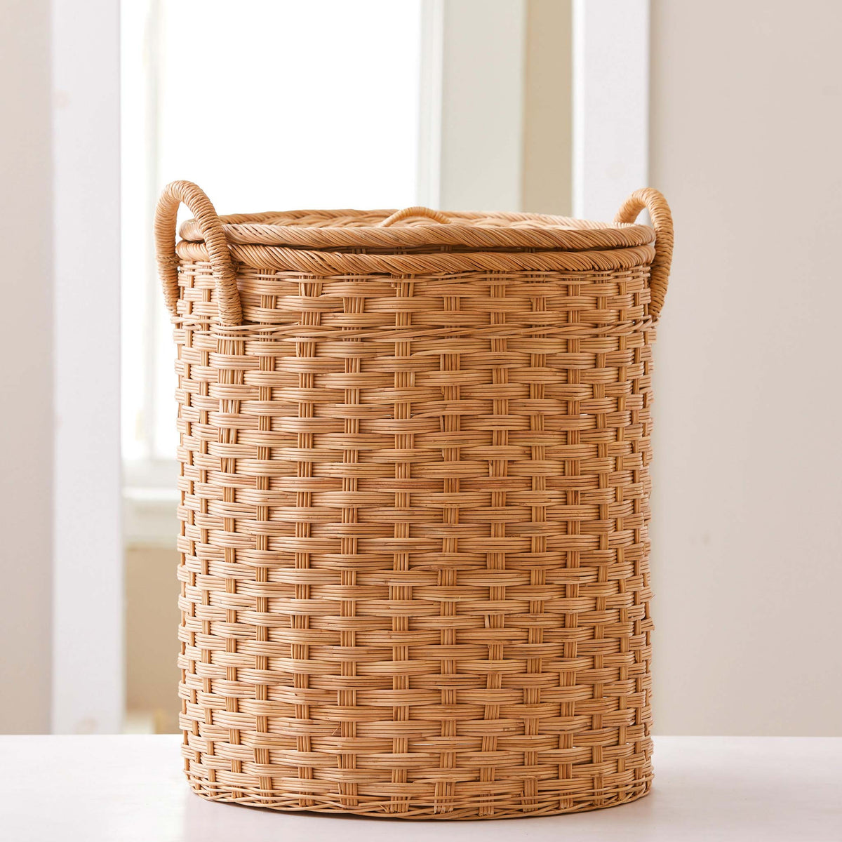 Oval rattan storage basket. Unique storage baskets with lids and handles. 5 sizes. Large basket shown. Great basket for storage. XL, L, M, S, XS.