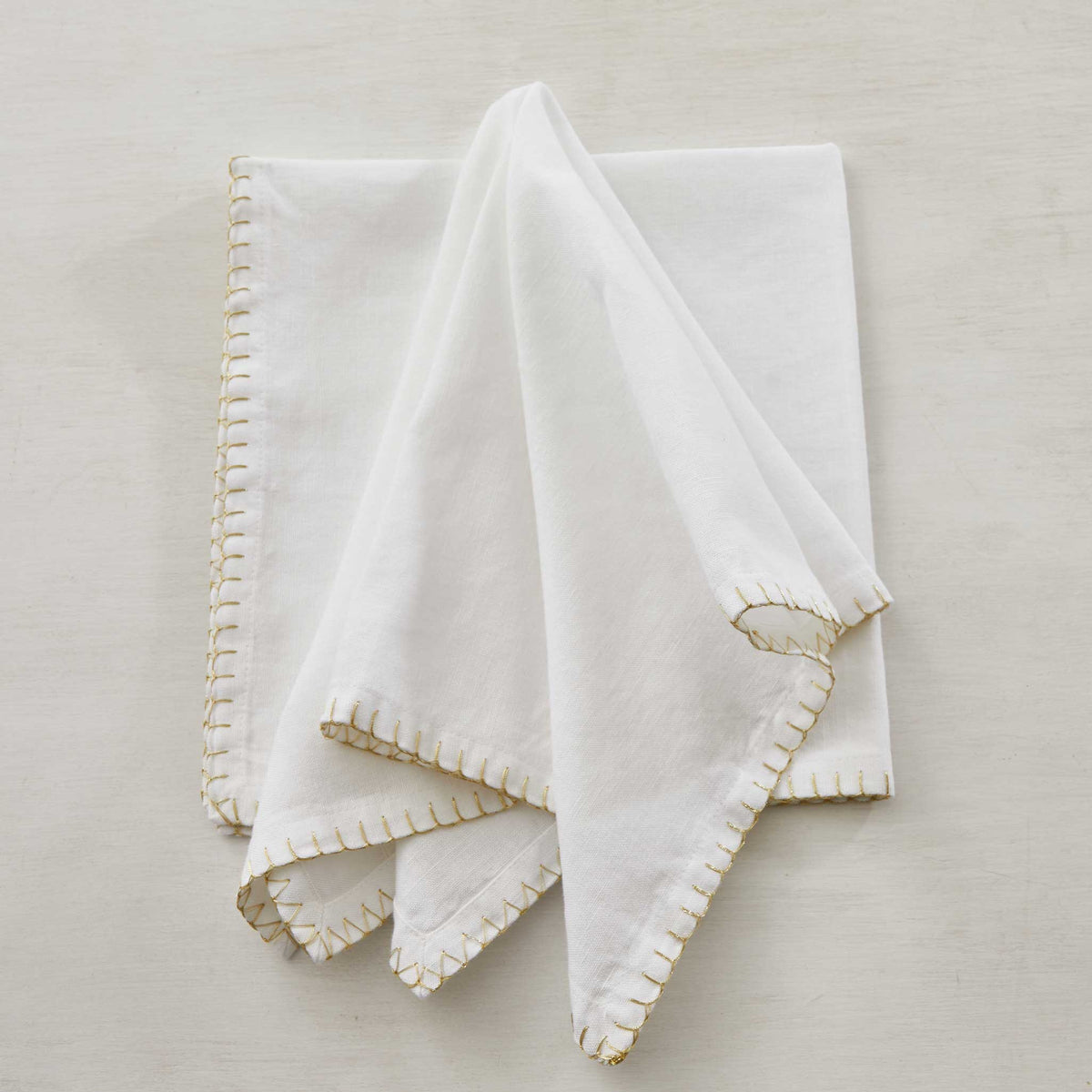 GOLD BLANKET-STITCHED LINEN NAPKIN