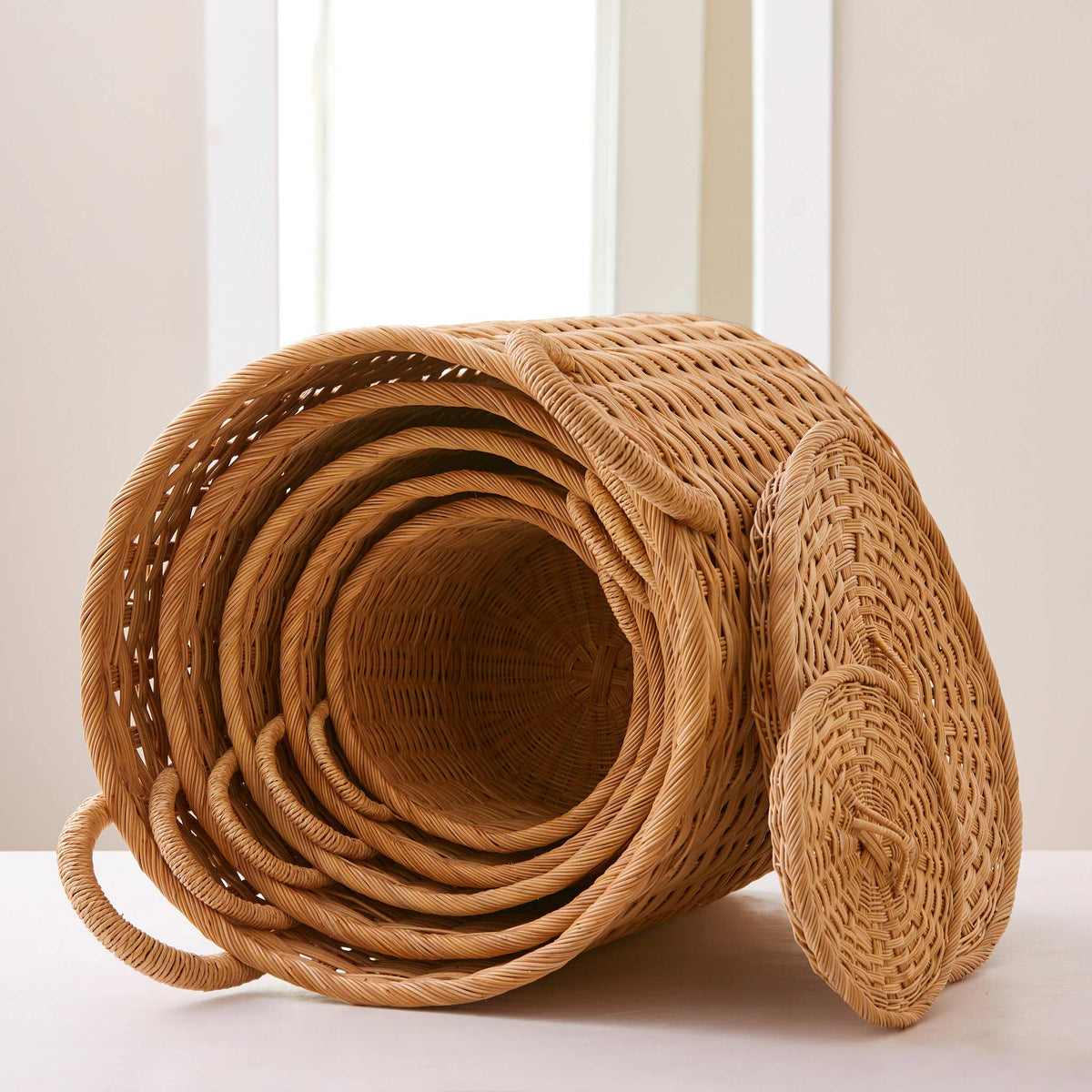 Round rattan storage baskets. Unique storage baskets with lids and handles. 5 sizes from large storage baskets to small. Perfect baskets for shelves.
